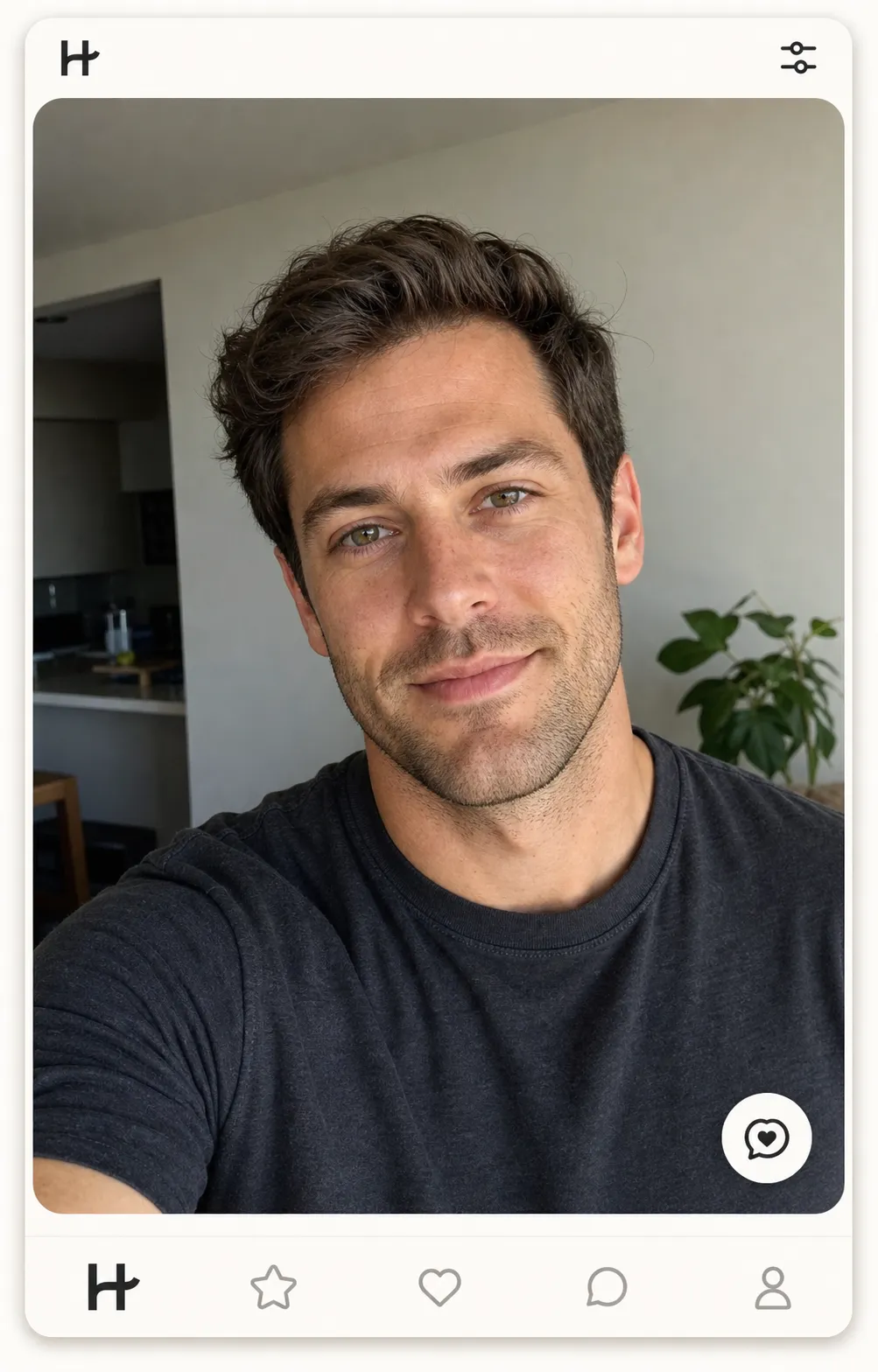 Hinge lead-photo example: a 4:5 portrait close-up of a man in his early thirties with brown hair, hazel eyes, square jaw, and light stubble inside a Hinge profile card, soft natural window light, warm half-smile with direct eye contact, plain charcoal cotton tee, identity-locked to demonstrate the Hinge lead-photo move in 2026.