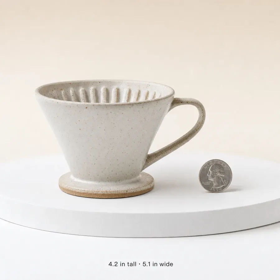Product on a small podium beside a familiar object for scale