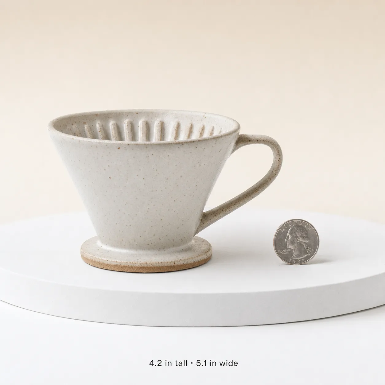 AI-generated Etsy scale-reference podium shot of a single product against a clean minimalist backdrop with a size reference, the slot-3 scale shot prompt in the same sub-4.1 family.