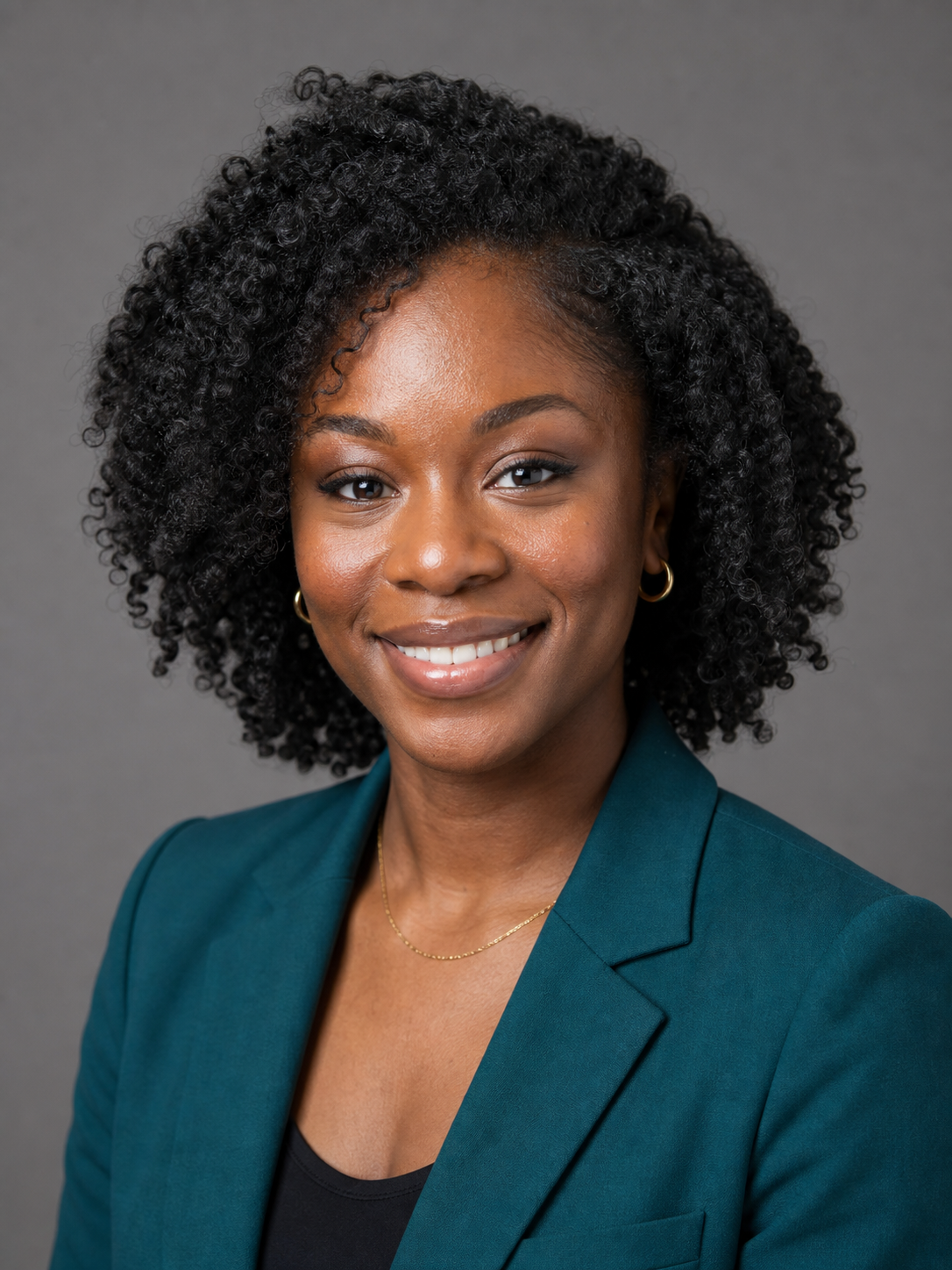 A clean headshot background swap, the same woman against a neutral mid-gray studio backdrop with a natural hair edge and lighting that matches her face, the corrected version that reads as a real studio photo.