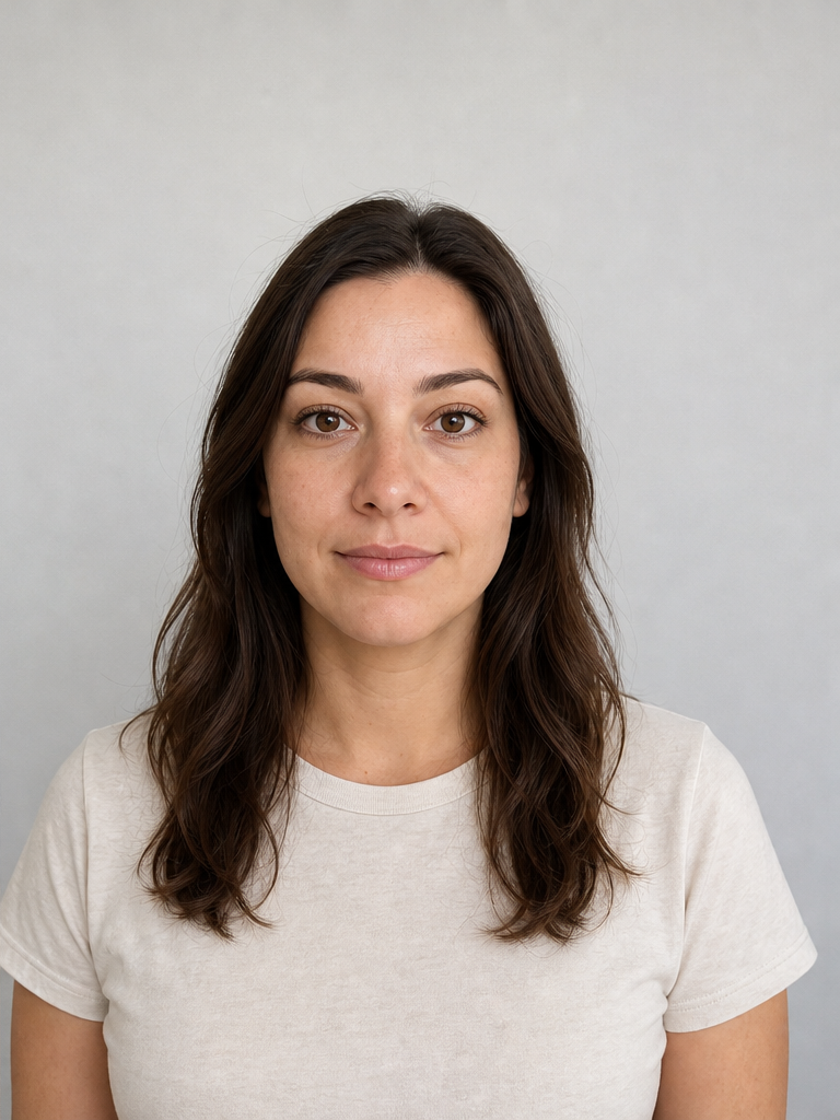 The same woman shot from a normal portrait distance at eye level, her facial proportions natural and undistorted.