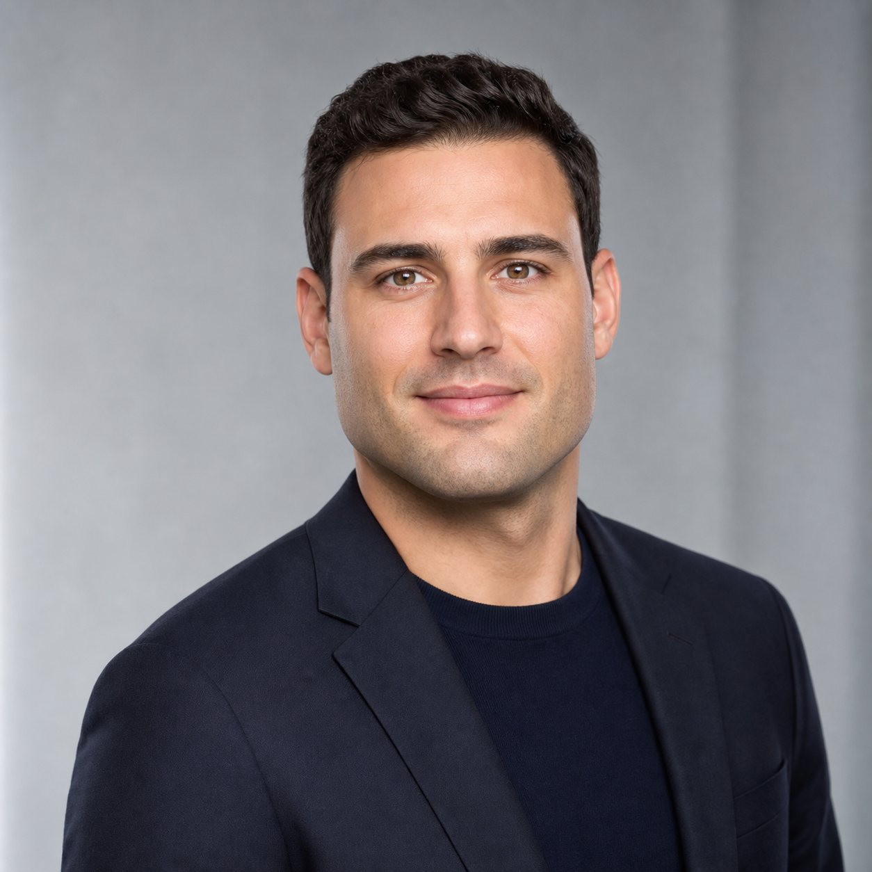 Example of identity drift in an AI generated LinkedIn headshot of a 30-something man, where jawline, eye spacing, and hairline subtly shift off the reference and the face looks almost-but-not-quite right.